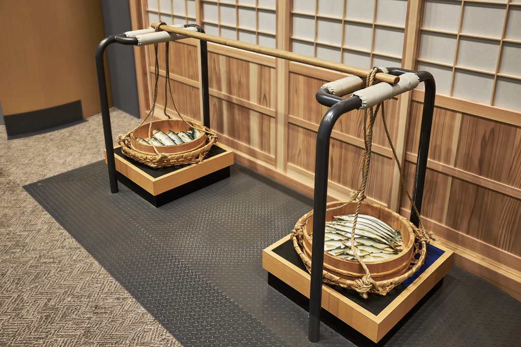 棒手振（ぼてふり）が担いだ天秤棒